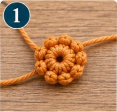 Step 1: a small orange crocheted puff-stitch center