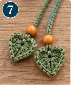 Step 7: two green hearts hanging from cords with wooden beads